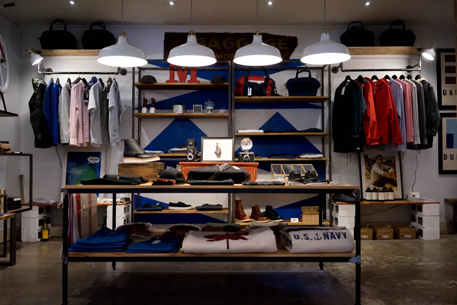 Boutique retail interior with hanging lights and wood shelving